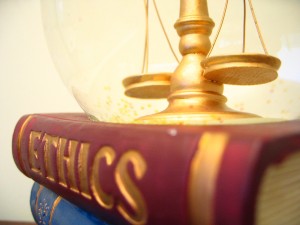 an image of scales on a book of Ethics